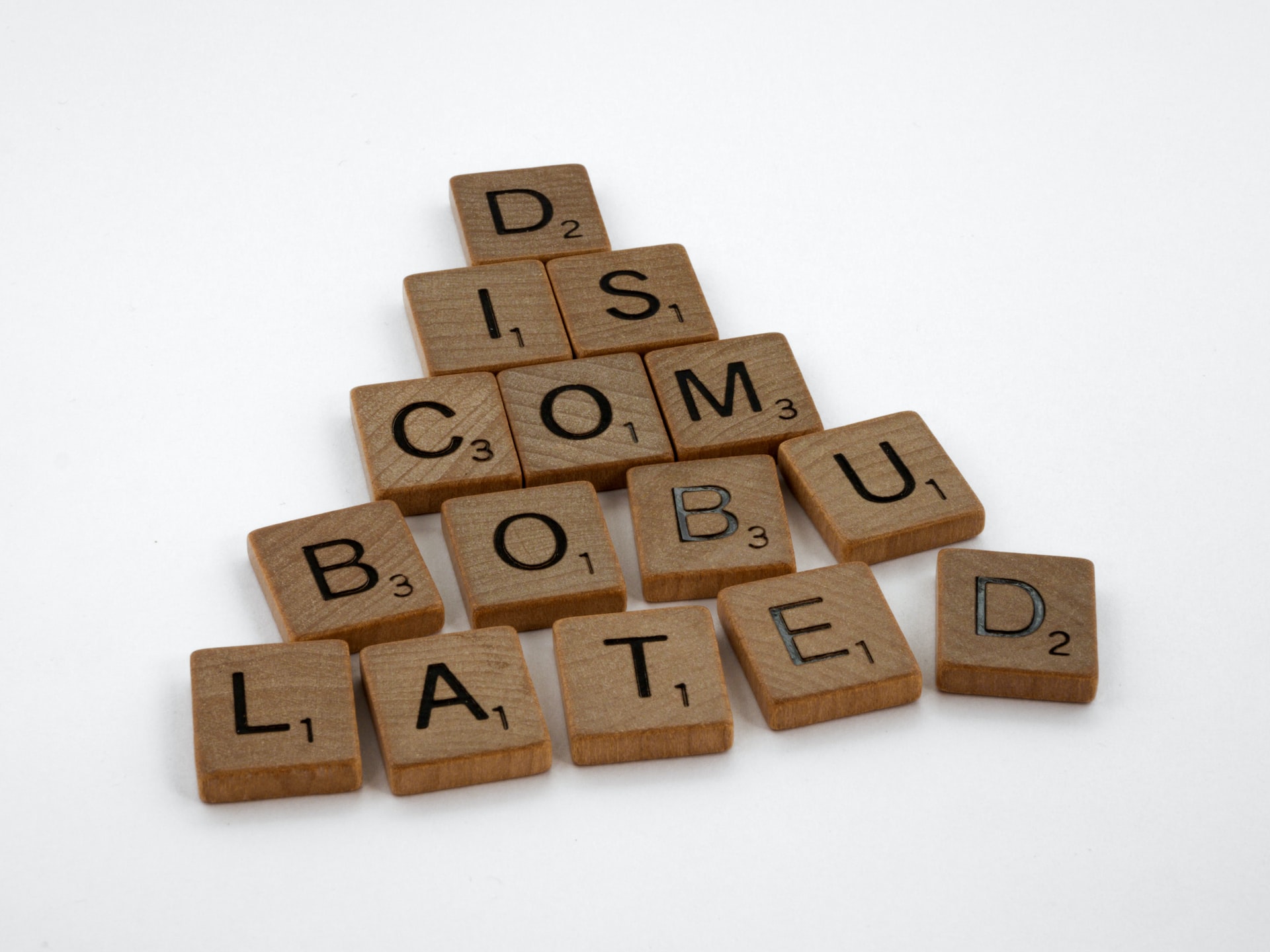 Scrabble tiles form the word discombobulated to signify misprinted books from IngramSpark