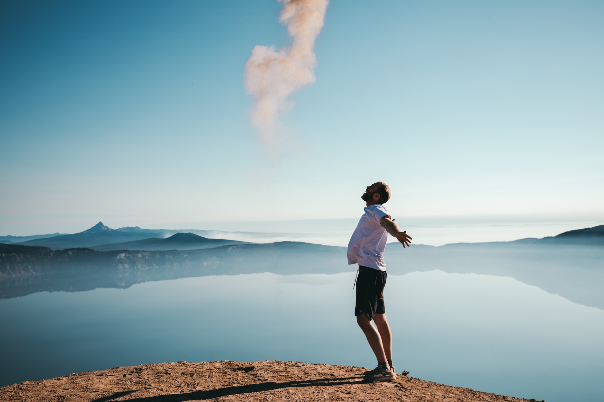 Image shows a man with arms outstretched in joy to illustrate the excitement authors should feel knowing that IngramSpark removed setup and revision charges.