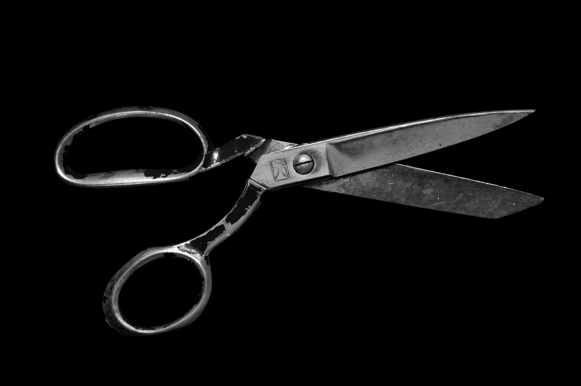Image shows scissors to illustrate the idea that a book editor will cut words from your manuscript.