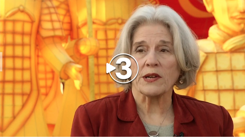 Image shows Ann Cater speaking on a News Channel 3 broadcast about The Pop-Up Project performing at the Chattanooga Zoo's Asian Lantern Festival.